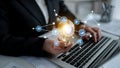 Business person using laptop with digital network icons, symbolizing innovation and technology integration in modern Royalty Free Stock Photo