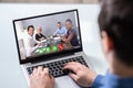 Businessperson Videoconferencing On Laptop