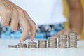 Business person walks fingers on steak with coins in direction of increasing profits Royalty Free Stock Photo