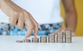 Business person walks fingers on steak with coins in direction of increasing profits Royalty Free Stock Photo