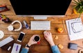 Business person working at office desk wearing smart watch Royalty Free Stock Photo