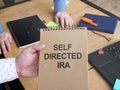 Business photo shows hand written text self directed ira