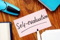 Business photo shows hand written text Self-evaluation