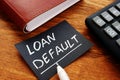 Business photo shows printed text Loan default