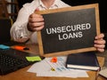 Business photo shows printed text unsecured loans Royalty Free Stock Photo