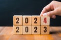 Business plan and countdown to 2024. Changing 2023 to 2024 on wooden block cube. Generative Ai