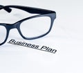 Business plan words near glasses, business concept