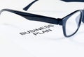 Business plan words near glasses, business concept