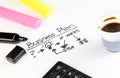 Business plan words near highlighters, calculator and cup of coffee, business concept Royalty Free Stock Photo