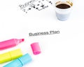 Business plan words near highlighters and cup of coffee, business concept Royalty Free Stock Photo