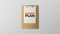 Business plan written on clipboard