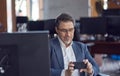 Business portrait - Businessman sitting at desk in office. Royalty Free Stock Photo