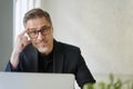 Business portrait - Businessman sitting at desk in office. Royalty Free Stock Photo