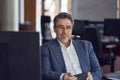 Business portrait - Businessman sitting at desk in office. Royalty Free Stock Photo