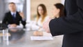 Business presentation. Businessman giving speech to colleagues and partners at corporate meeting or conference, close-up Royalty Free Stock Photo