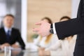 Business presentation. Businessman giving speech to colleagues and partners at corporate meeting or conference, close-up Royalty Free Stock Photo