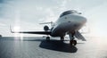 Business private jet airplane parked at airfield and ready for flight. Luxury tourism and business travel transportation