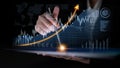 Business professional analyzes data trends with interactive tablet, showcasing upward growth on chart with digital Royalty Free Stock Photo