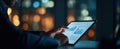 The business professional analyzes financial data on a tablet at night..AI generated image Royalty Free Stock Photo