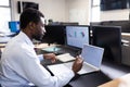 Business professional analyzing data on laptop and discussing strategy in office, copy space