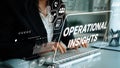 Business professional analyzing data with operational insights displayed on futuristic interface and keyboard in modern Royalty Free Stock Photo
