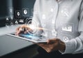 Business professional analyzing data on a tablet with futuristic interface elements Royalty Free Stock Photo