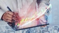 Business professional analyzing data trends on a digital tablet with financial charts and graphs displayed for effective Royalty Free Stock Photo