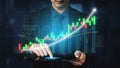 Business professional analyzing data trends on a tablet with digital chart graphics and upward growth indicators Impute Royalty Free Stock Photo