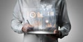 Business professional analyzing data trends with tablet and digital graphs, modern technology concept for analytics and Royalty Free Stock Photo