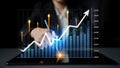 Business professional analyzing financial data with digital graph, market trends, and growth indicators on a tablet Royalty Free Stock Photo