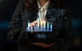 Business professional analyzing financial data with futuristic interface displaying charts, graphs, and world map in Royalty Free Stock Photo