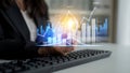 Business Professional Analyzing Financial Data with Graphs and Charts on Digital Screen While Using Computer Keyboard in Royalty Free Stock Photo