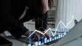Business Professional Analyzing Financial Data with Graphs and Charts on Laptop, Modern Office Setting, Focused Work Royalty Free Stock Photo