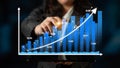 Business Professional Analyzing Financial Growth Using Modern Technology with Graphs and Data Visualization Tools in Royalty Free Stock Photo