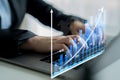 Business Professional Analyzing Data Trends on Laptop with Digital Graphs, Indicators, and Statistical Metrics Displayed Royalty Free Stock Photo