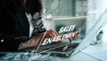 Business professional engaged in sales enablement strategy using laptop with digital graphics on screen for modern Royalty Free Stock Photo