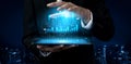 Business professional analyzing data with holographic graphs on a digital tablet in a modern city skyline at night Scalp Royalty Free Stock Photo