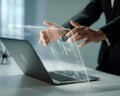 Business professional interacting with advanced technology interface on laptop Royalty Free Stock Photo