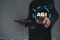 Business professional interacting with AGI artificial intelligence interface visualizing data analytics,machine learning systems, Royalty Free Stock Photo