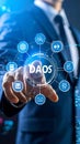 Business professional interacting with DAOS interface with connected icons and elements Royalty Free Stock Photo