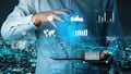Business Professional Interacting with Futuristic Data Visualization in a Modern Urban Setting at Night xenic Royalty Free Stock Photo