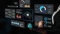 Business professional interacting with futuristic data visualization screen showcasing AI agents, analytics, graphs Royalty Free Stock Photo