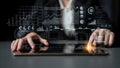 Business professional interacting with modern digital tablet while analyzing financial data and charts in a contemporary Royalty Free Stock Photo