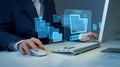 Business professional using computer with digital folder interface for file management visualization Royalty Free Stock Photo