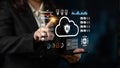 Business professional interacting with digital cloud technology and data security icons on a futuristic tablet interface Royalty Free Stock Photo