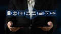 Business Professional Showcasing Low Code Platform Concept on Tablet with Technology Icons and Data Visualization Royalty Free Stock Photo