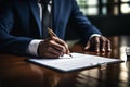 Business professional signing contract documents, close up on hands