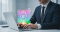 A business professional is typing on a laptop with a glowing artificial intelligence chatbot display floating above the Royalty Free Stock Photo