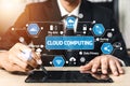 Business Professional Using Digital Tablet with Cloud Computing Icons and Graphics Representing Technology Solutions in Royalty Free Stock Photo