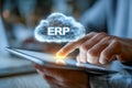 Business professional using digital tablet to access cloud-based erp system symbolizing modern enterprise resource planning and Royalty Free Stock Photo